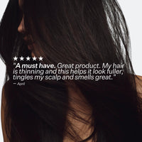 Close-up of a person with long dark hair, featuring a five-star rating text overlay.