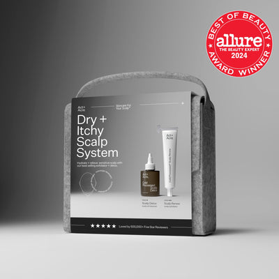 Act+Acre Dry + Itchy Scalp System gift set displayed in a gray felt case, featuring the Scalp Detox and Scalp Renew products, with an Allure Best of Beauty 2024 award badge.