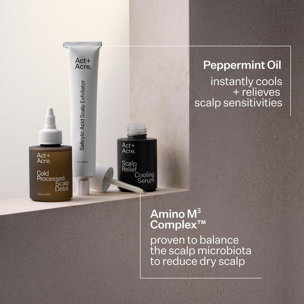 Three Act+ Acreo scalp care products arranged on a shelf against a neutral beige and taupe background: a brown bottle labeled Cold Processed Scalp Detox, a black bottle labeled Scalp Relief Cooling Serum, and a white tube labeled Silky Soft Scalp Elixir. Text callouts describe Peppermint Oil and Amino M3 Complex benefits.