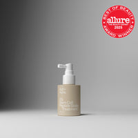 Skincare bottle with 'Allure Best of Beauty 2025' award on a gray background